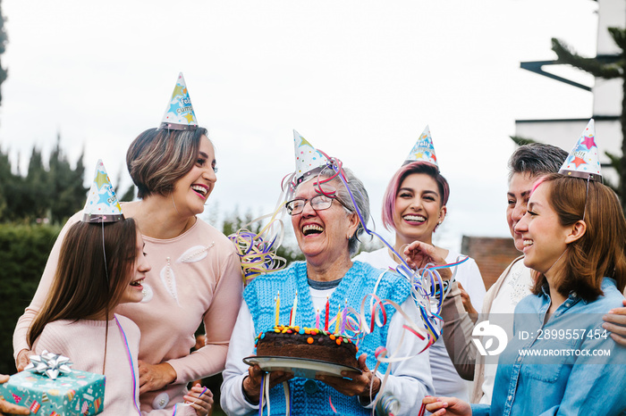 three generations hispanic women Family Celebrating a happy Birthday in Latin America