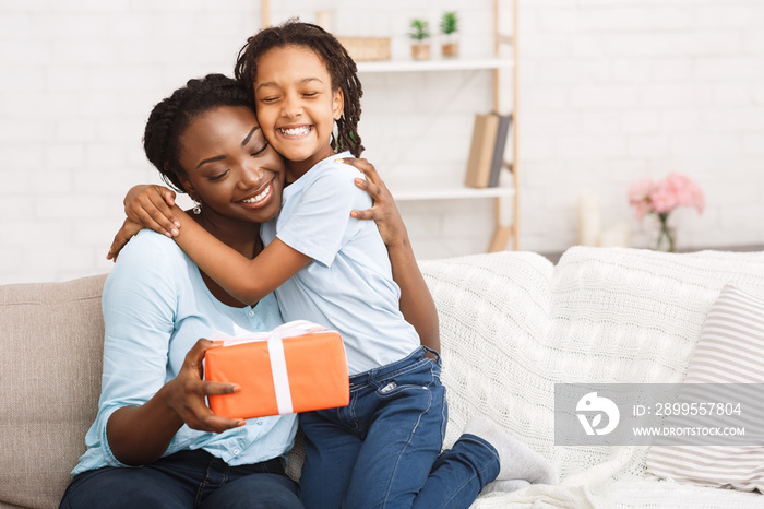 Black girl congratulating her mom with birthday