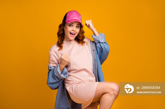 Portrait of her she nice-looking attractive lovely pretty cheerful cheery girl having fun celebrating good news victory isolated on bright vivid shine vibrant yellow color background