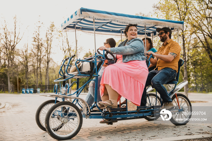 4 friends ride a bike