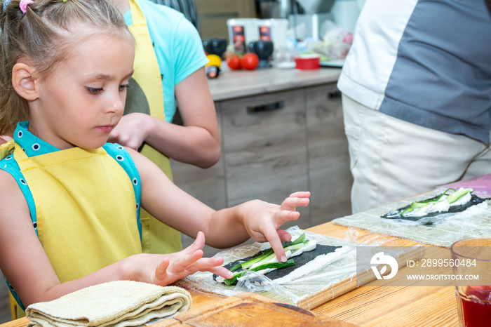 little girl cooks sushi