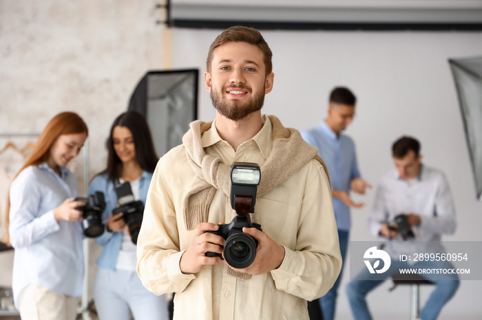 Male photographer during classes in studio