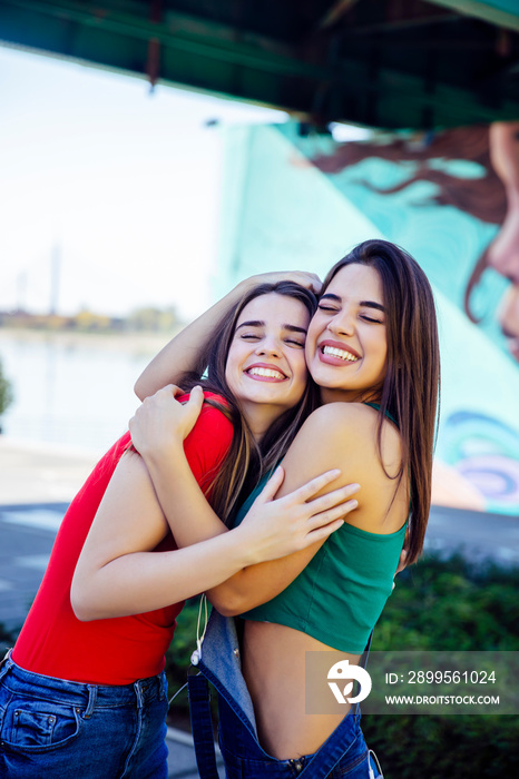 Two best female friends embracing together