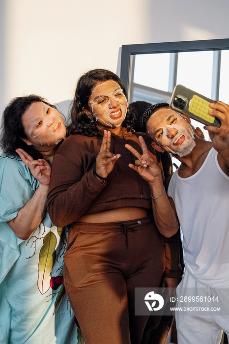 Friends doing face masks together at home