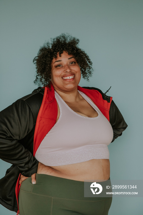 portrait of a plus size afro indigenous person in workout attire