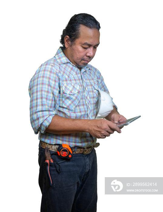 Enigineer with white helmet looking at his tablet