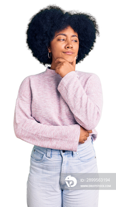 Young african american girl wearing casual clothes with hand on chin thinking about question, pensive expression. smiling with thoughtful face. doubt concept.