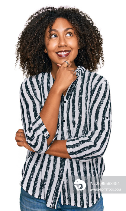 Young african american girl wearing casual clothes with hand on chin thinking about question, pensive expression. smiling with thoughtful face. doubt concept.