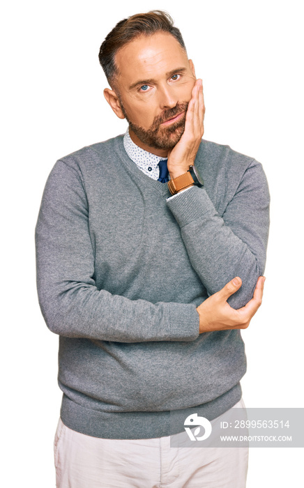 Handsome middle age man wearing business clothes thinking looking tired and bored with depression problems with crossed arms.