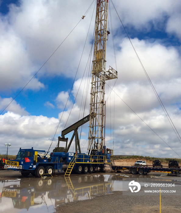 Pulling Unit Installing Pump Jack