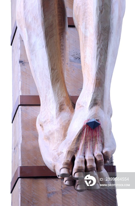 wooden feet with blood of a statue