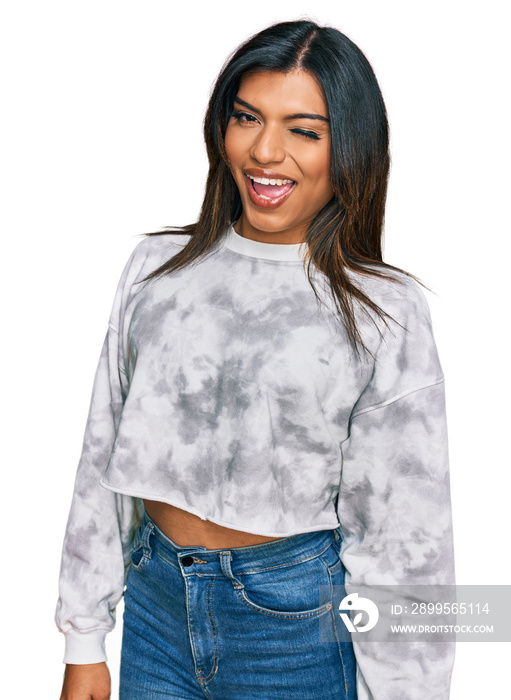 Young latin transsexual transgender woman wearing casual clothes winking looking at the camera with sexy expression, cheerful and happy face.