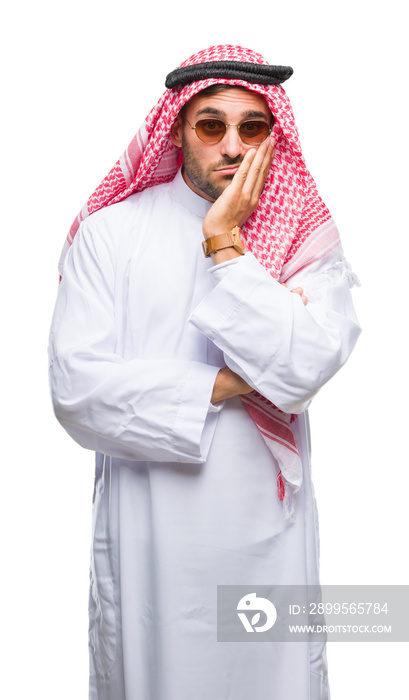 Young handsome man wearing keffiyeh over isolated background thinking looking tired and bored with depression problems with crossed arms.