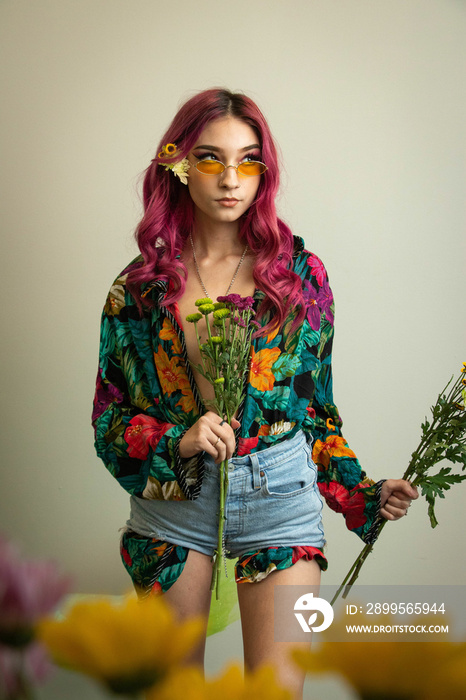 flowers model flower child pink hair retro vintage fashion editorial floral nature hippie hippies chick studio modeling fashion photography studio grey background young woman women teenager 1960s 60s