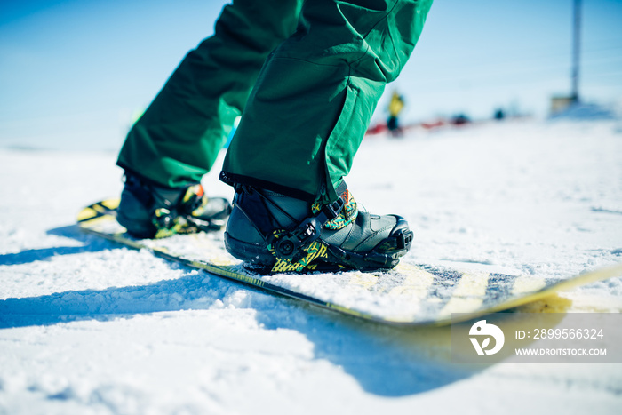 Snowboarder riding a snow hill, extreme sport