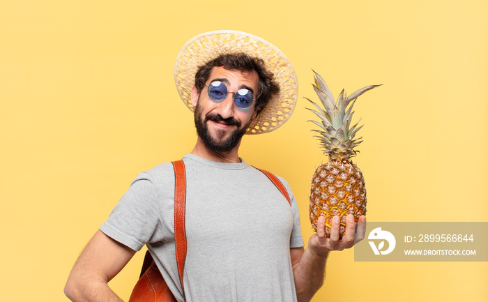 young crazy traveler man happy expression and holding a pineapple