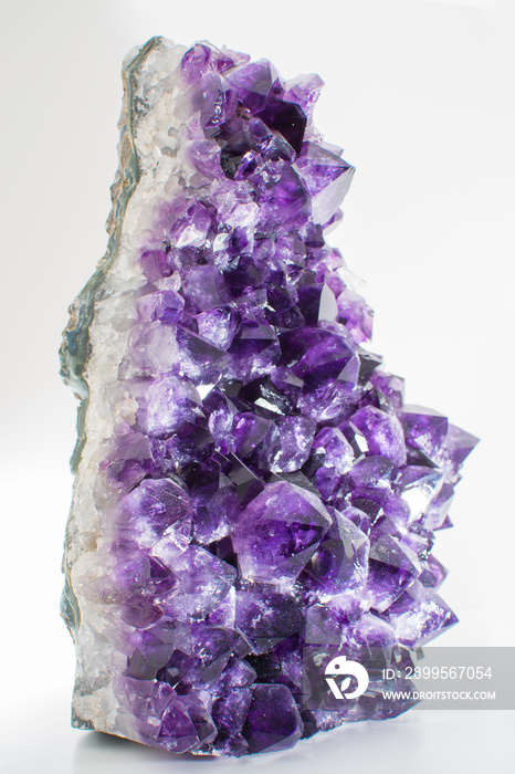 Beautiful big purple bright gemstone amethyst crystal isolated close up