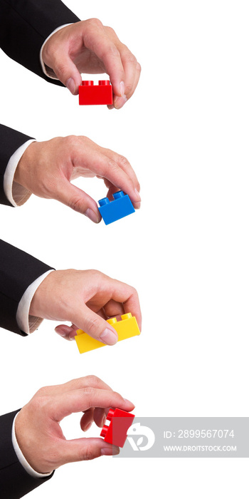 business man hand holding a plastic block