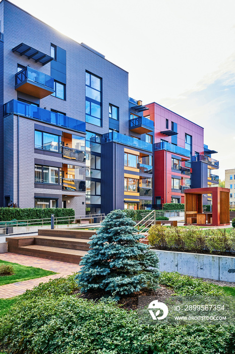 Modern complex of residential buildings and green trees