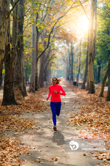 Woman Jogging Outdoors in Park