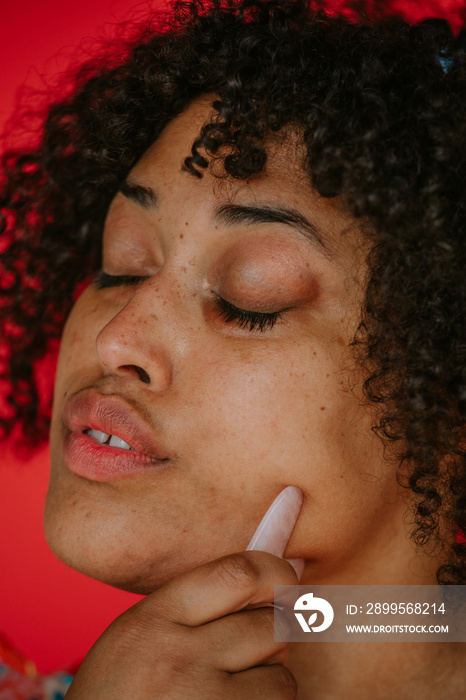 closeup of black agender person practicing skincare