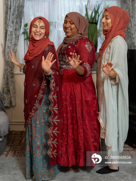 Women dancing during Ramadan celebration at home