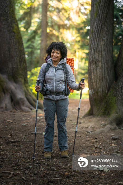 U.S. Army female soldier putting in the miles with an early morning hike in the NorthWest.