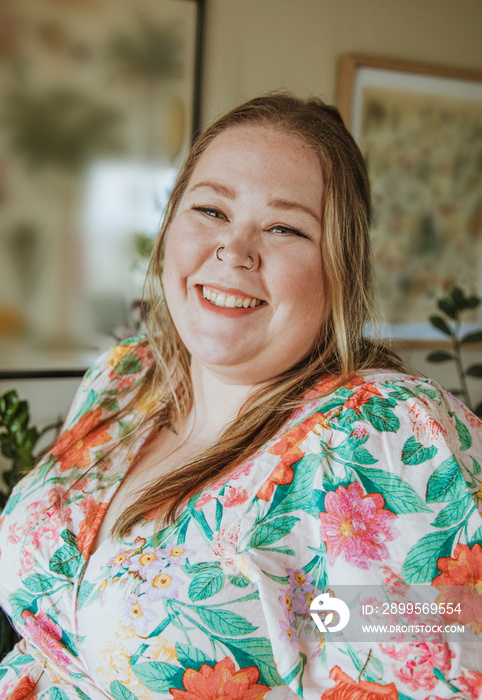 closeup of woman smiling wearing floral dress