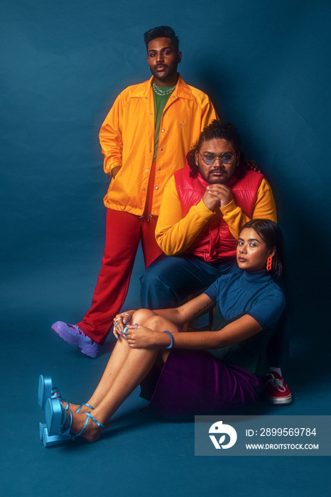 Asian trio colour blocked fashion studio portrait