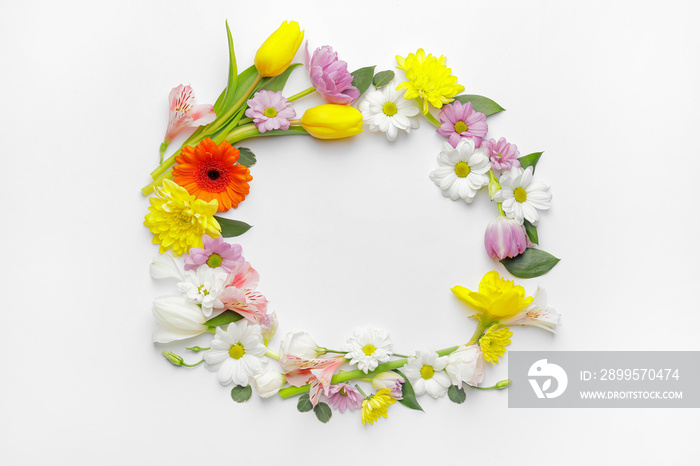 Frame made of beautiful flowers on white background