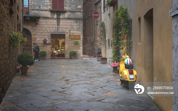 Bike parked on the Colorful street in Pienza, Tuscany, Italy