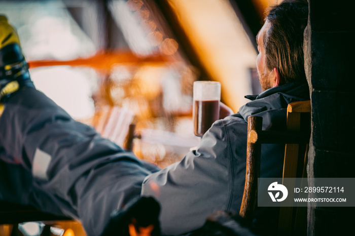 A Skier Drinking Cocoa In A Ski Lodge