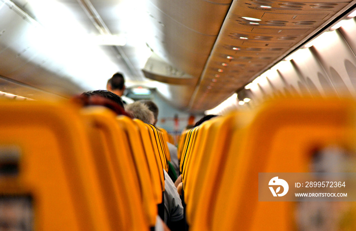 Ryanair Jet airplanes interior between the seats view. Ryanair is the biggest low-cost airline company in the world.