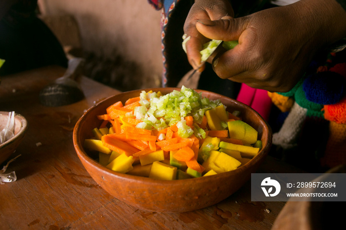 Cooking a traditional Andean vegetable soup before a Pachamanca feast with a Quechua tribe in the Sacred Valley, Peru.