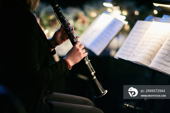 woman playing clarinet at concert