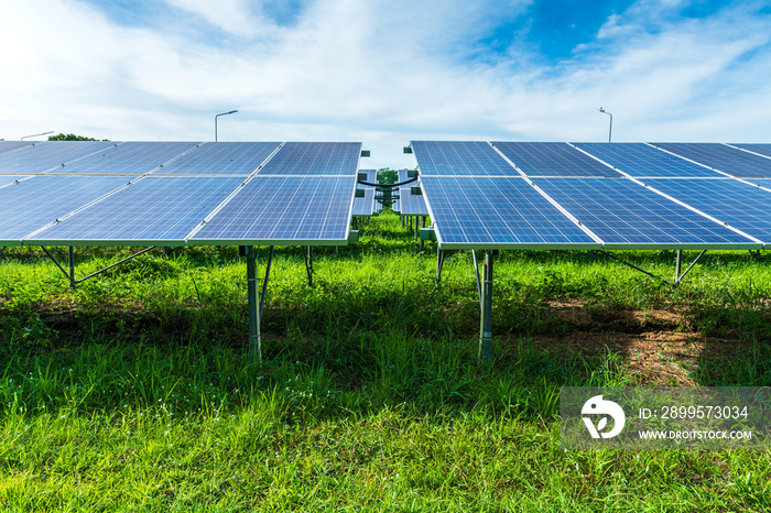 Photovoltaic solar power panel on dramatic sunset blue sky background, green clean Alternative power energy concept.