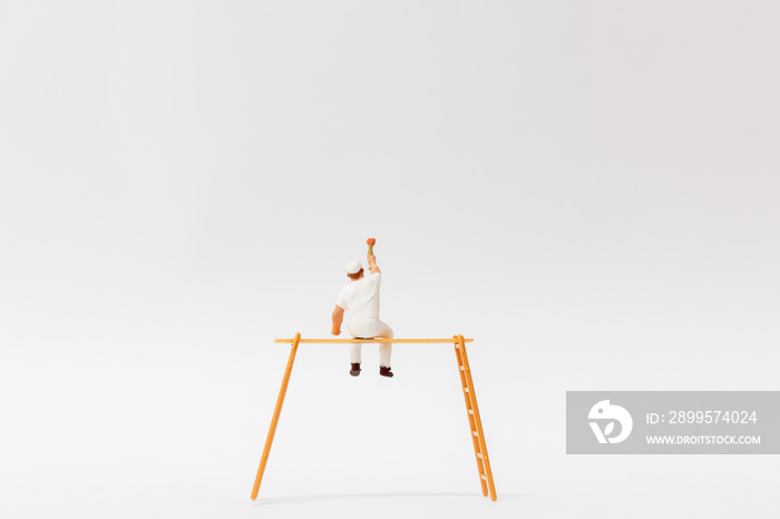 Miniature people : Painter holding a brush with  space for text