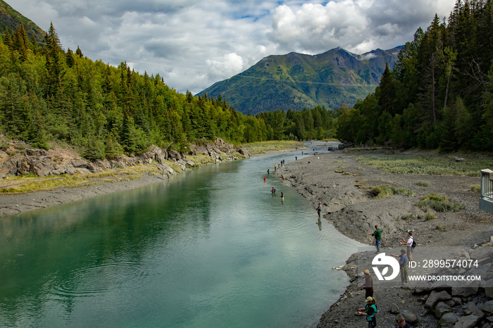 People fishing for salmon in Bird Creek where it passes under the Seward Highway in Southern Alaska.