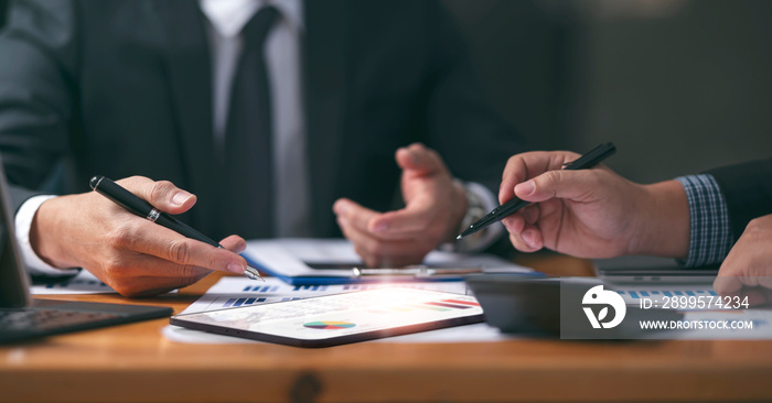 Businessman team working at office with document on his desk, doing planning analyzing the financial report, business plan investment, finance analysis concept. Economic business discussions.