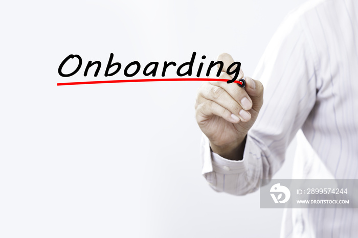 Businessman hand writing onboarding with red marker on transpare