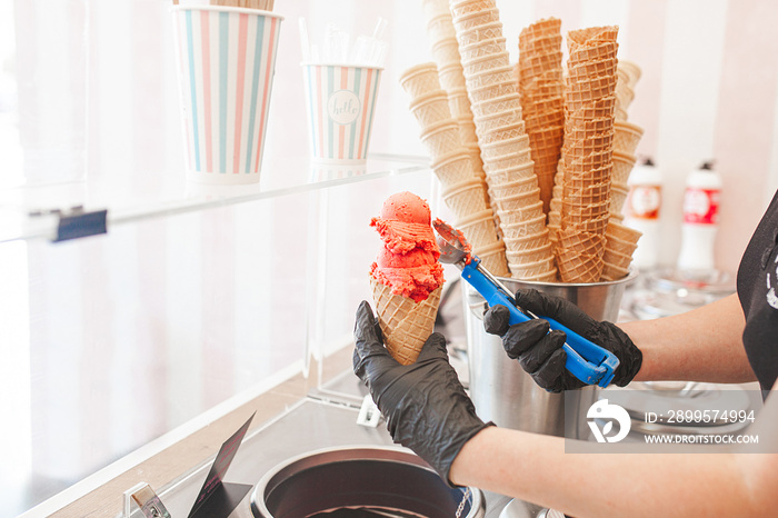 Process of making ice cream. Professional ice cream dessert making in cafeteria. Ice cream equipment.