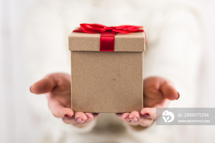 Present box in woman’s hands