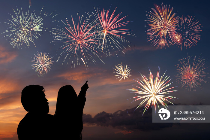 Happy father and daughter looks fireworks