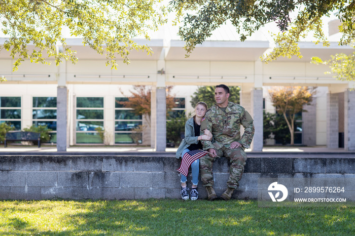 Soldier sitting with his daughter