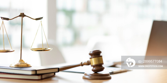 Business and lawyers discussing contract papers with brass scale on desk in office. Law, legal services, advice, justice and law concept picture with film grain effect