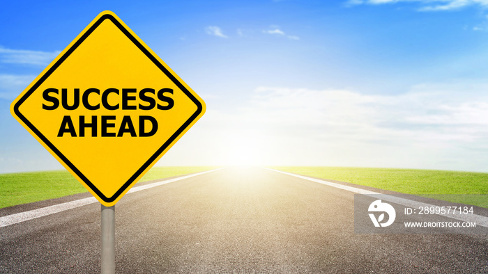 Success ahead road sign on asphalt road with colorful light background. Concept of success in the future goal