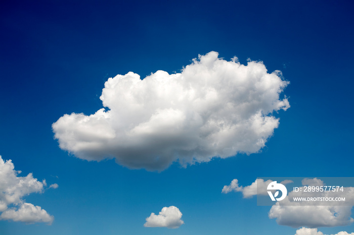 Fluffy white clouds in blue sky