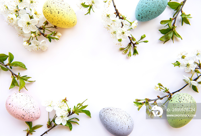 Colorful Easter eggs with spring blossom flowers