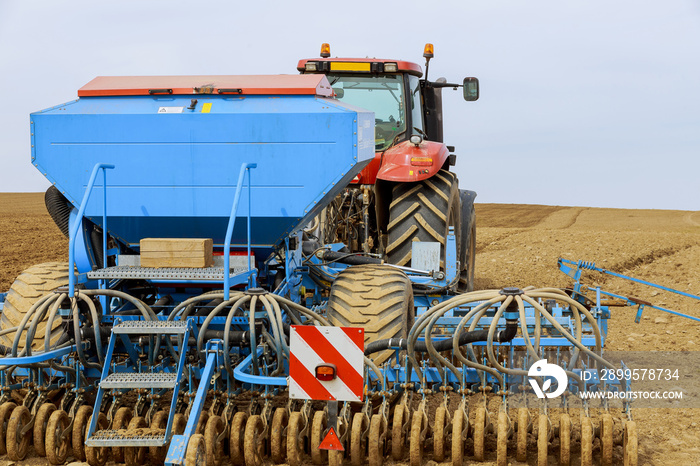 The precision air seeder is attached to the tractor. Agricultural machinery.