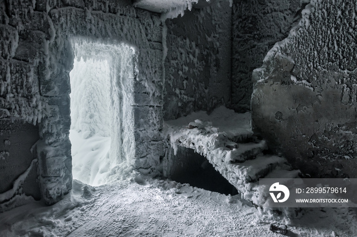 snow-covered abandoned buildind with stairs